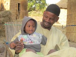 Milk producer with is son, Burkina Faso, © E Vall